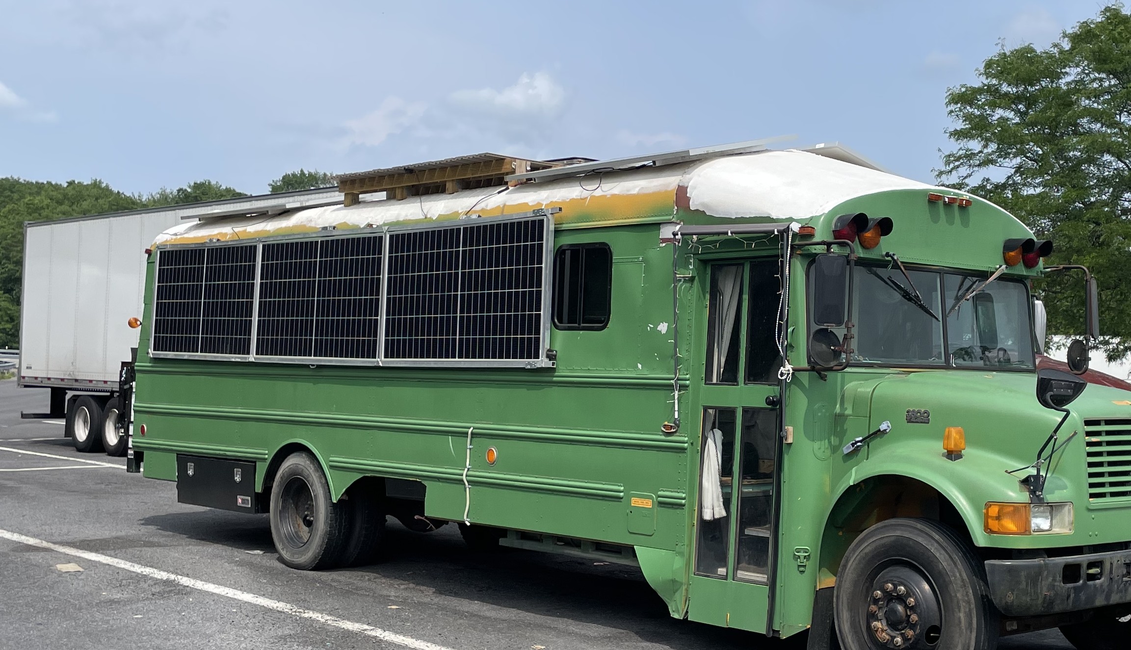 School bus converted into tiny home and mobile workshop